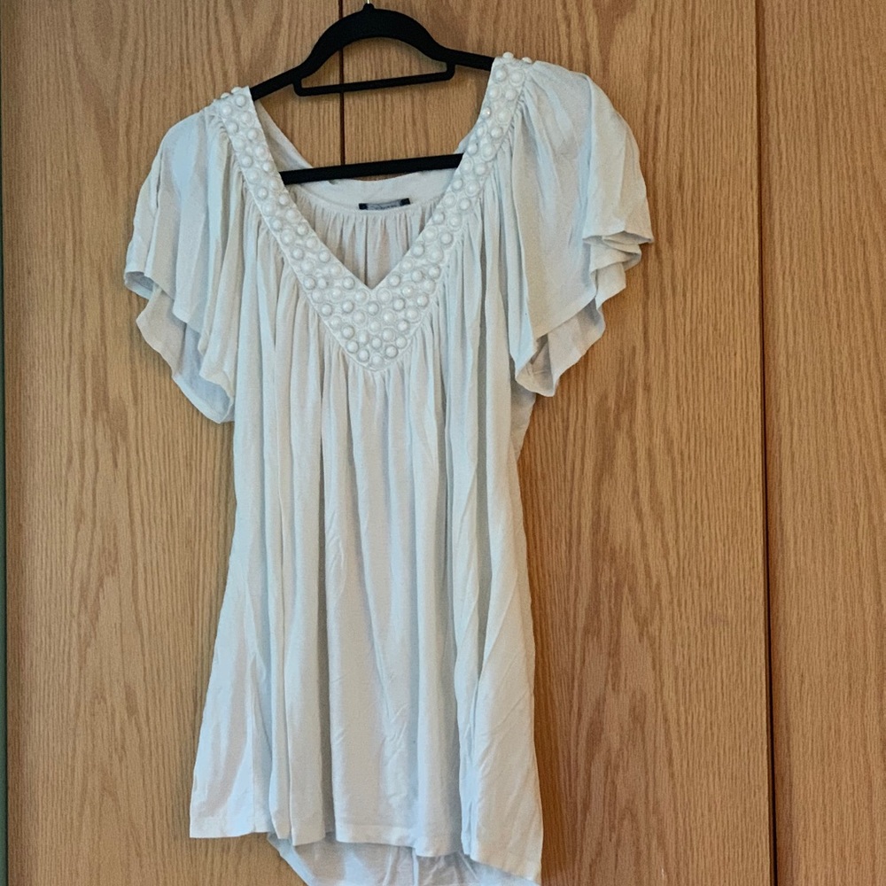 White blouse with beaded embellishment